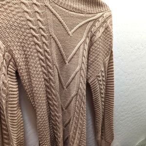 Small light brown sweater dress. Perfect with boots for the winter!